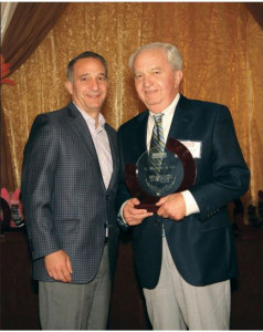 Angelo Sr. and Angelo Jr. accept award cropped
